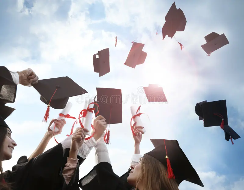 happy students diplomas throwing graduation hats air outdoors 185327350
