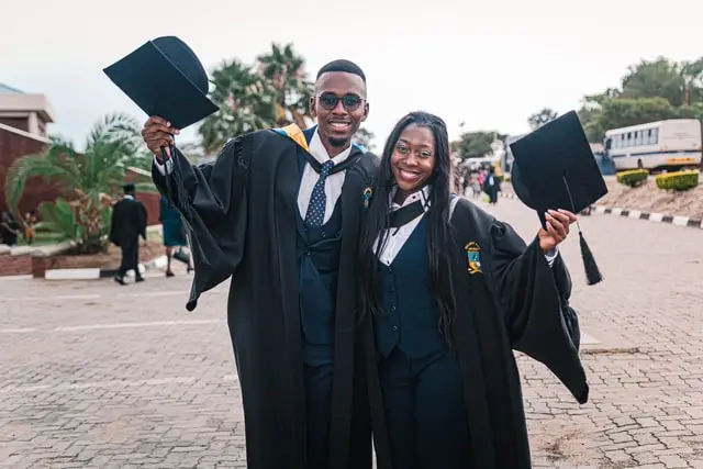 Join UNILAG 2026 Post UTME Aspirants WhatsApp Group 2 Two students wearing graduation gown